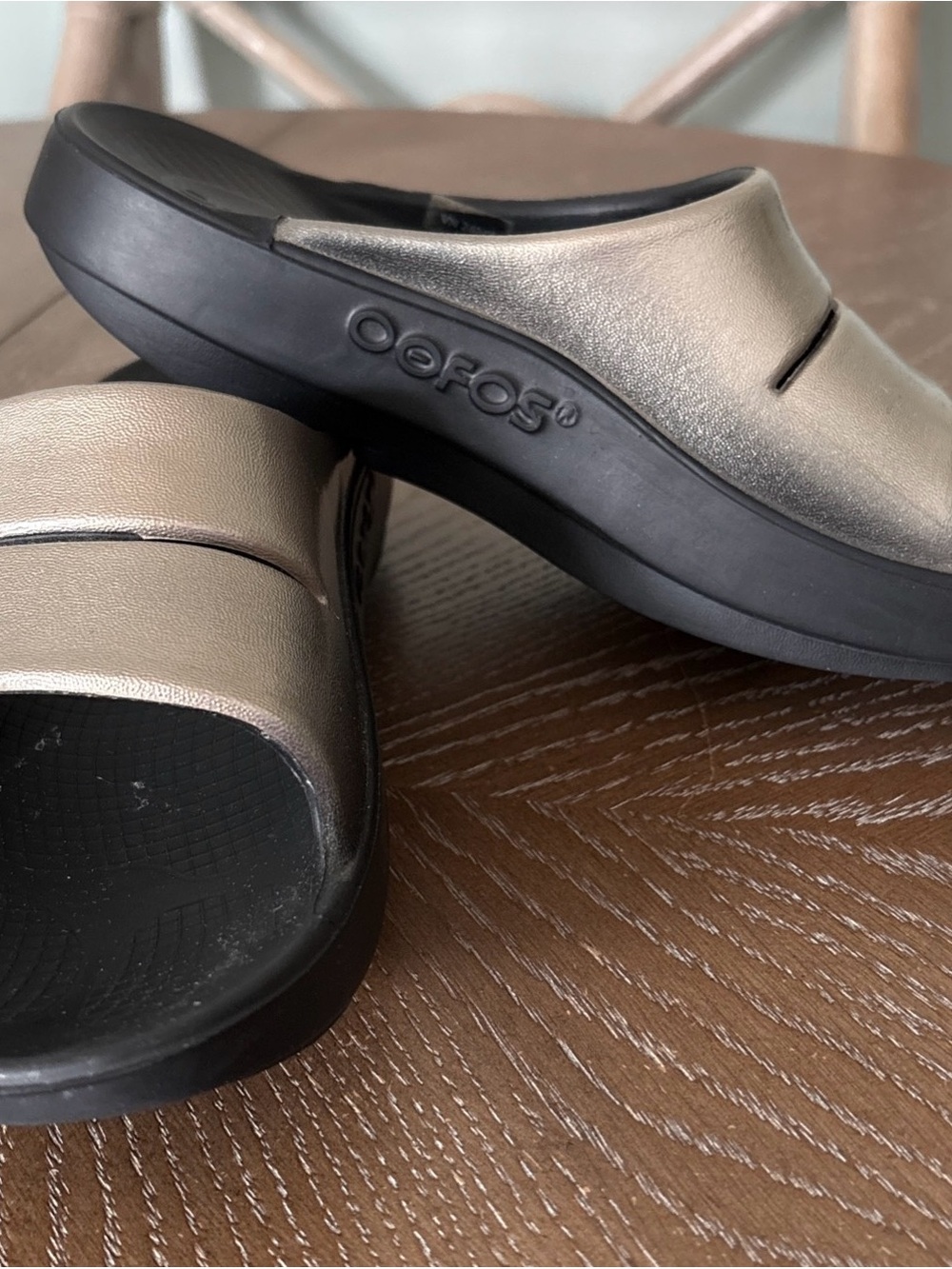 OOFOS Women's Metallic Bronze Slide Sandals with Black Sole